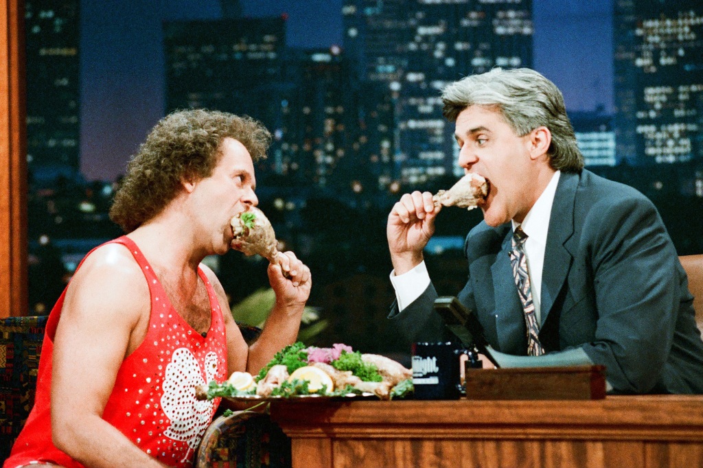 The flamboyant fitness fanatic became a fixture on late night TV shows, quipping with comedians. He is seen with Jay Leno in 1995. 