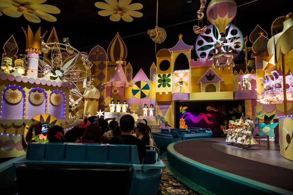 Visitors ride in a boat at the "It's A Small World" ride at Walt Disney Co.'s Disneyland Resor