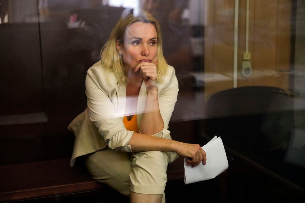 Marina Ovsyannikova, a former Russian state TV journalist who quit after making an on-air protest of Russia's military operation in Ukraine, listens sitting in a court room during a hearing in Moscow, Russia, Thursday, Aug. 11, 2022.