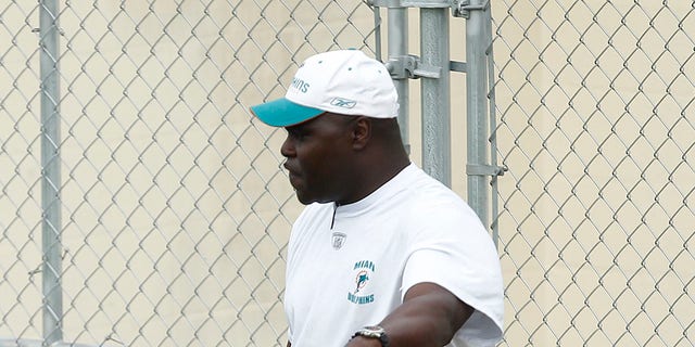 Running backs coach James Saxon works with James Aldridge of the Miami Dolphins on blocking drills during rookie minicamp May 1, 2010, at the Miami Dolphins' training facility in Davie, Fla.