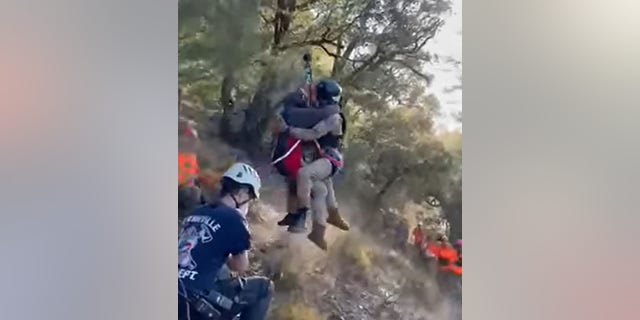 Rescue personnel hoisted the mother out of the canyon via helicopter.