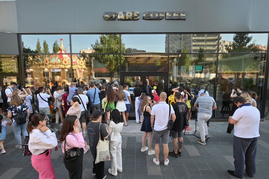 Crowds gather to visit a newly opened Stars Coffee coffee shop in Moscow.