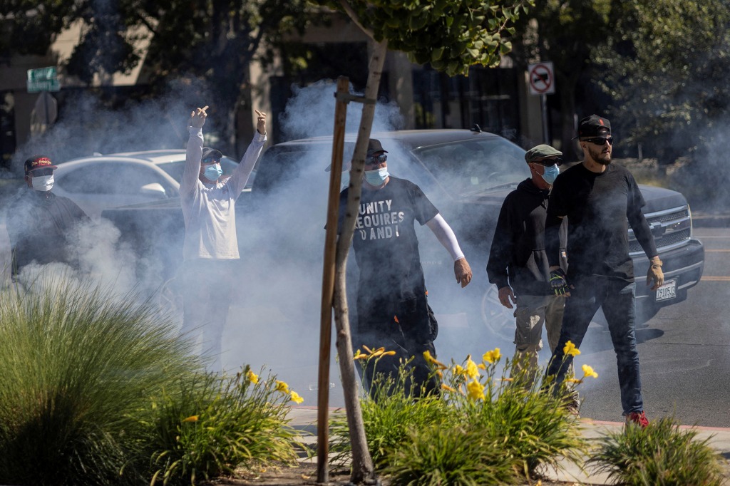 Straight Pride Parade attendees are seen during a confrontation with counter-protesters (not pictured) outside a Planned Parenthood office in Modesto, California, U.S., August 27, 2022. 