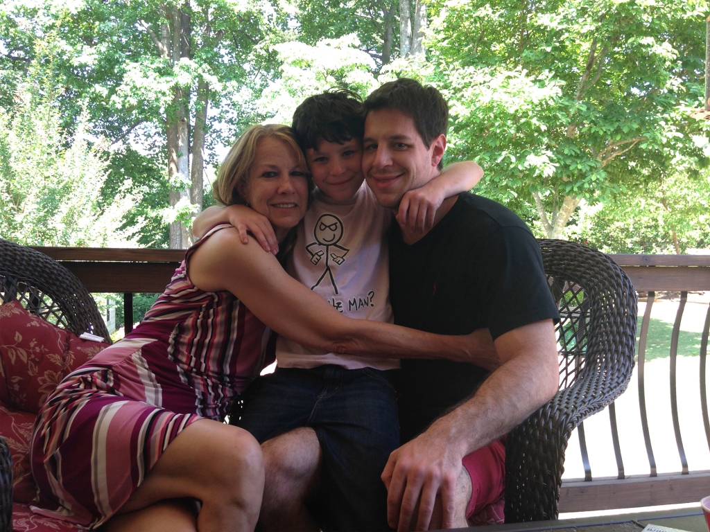 Justin Gilmore with his mother and son