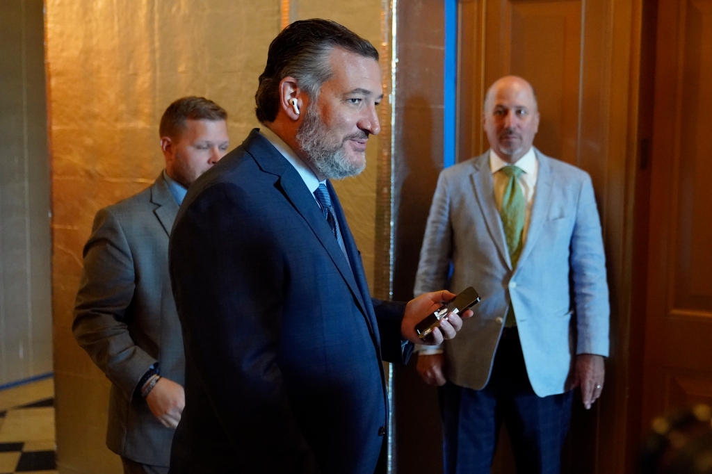 Sen. Ted Cruz, R-Texas, steps out of the Senate Chamber on Capitol Hill in Washington, Saturday, Aug. 6, 2022. (AP Photo/Patrick Semansky)