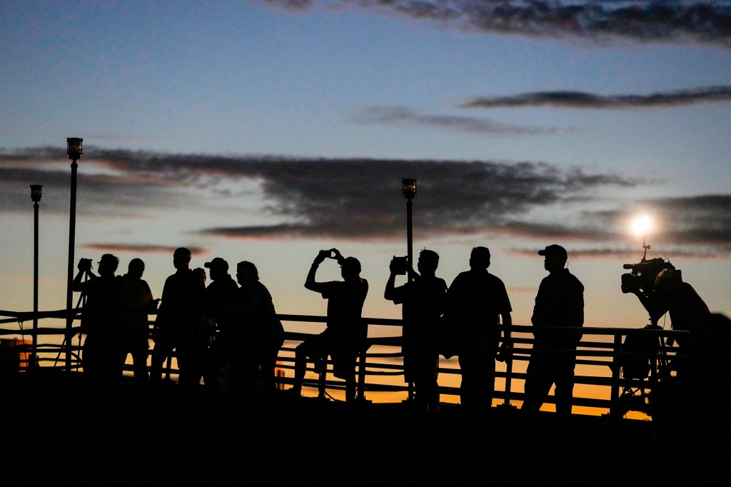 Pre-dawn crowds gathered in the Houston area to see the ship's historic move.