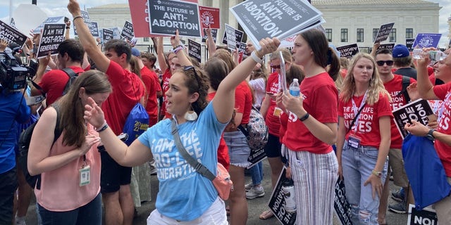 Pro-life activists react to the Supreme Court decision overruling Roe vs. Wade.