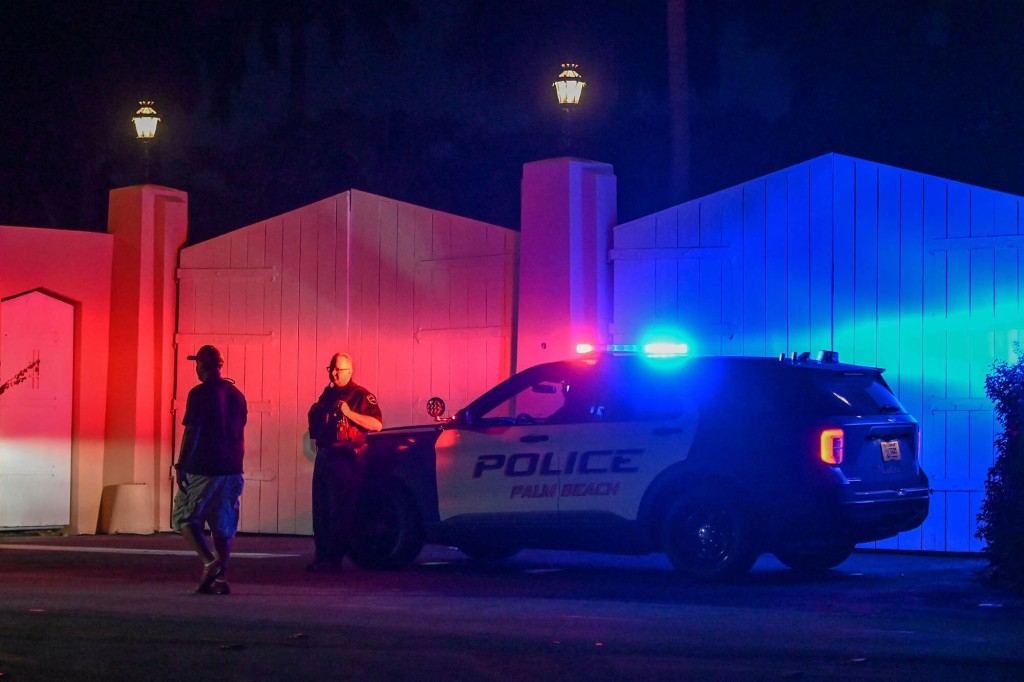 A police car is seen outside former US President Donald Trump's residence in Mar-A-Lago, Palm Beach, Florida on August 8, 2022.