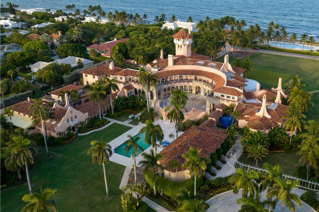 The filings showed a photograph of the documents labeled  "TOP SECRET laid out on a carpet at Mar-a-Lago.