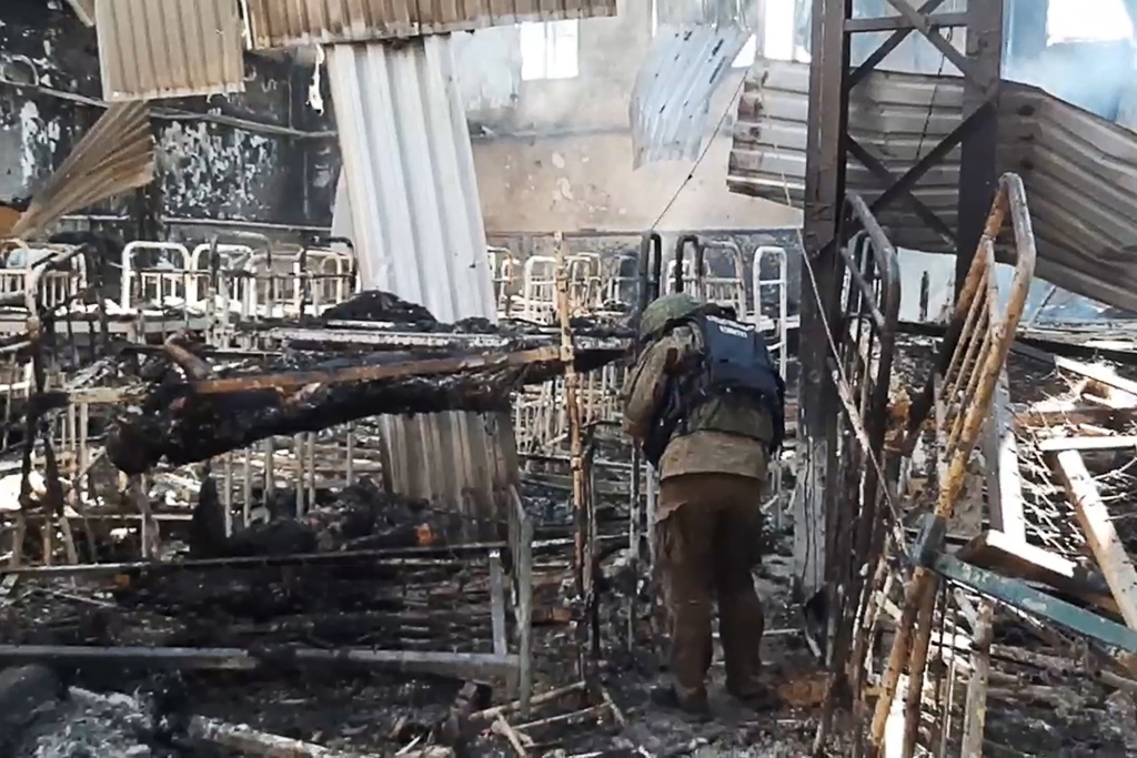 A video screen grab shows a view of a temporary accommodation center in Olenivka for captives from the Ukrainian National Guard's Azov Battalion.
