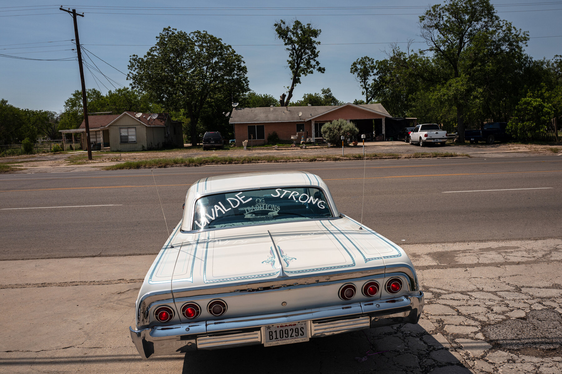 Tito Moncada left an event honoring the victims of the shooting in his 1960s-era Chevrolet Impala, which has “Uvalde Strong” written on the rear window.