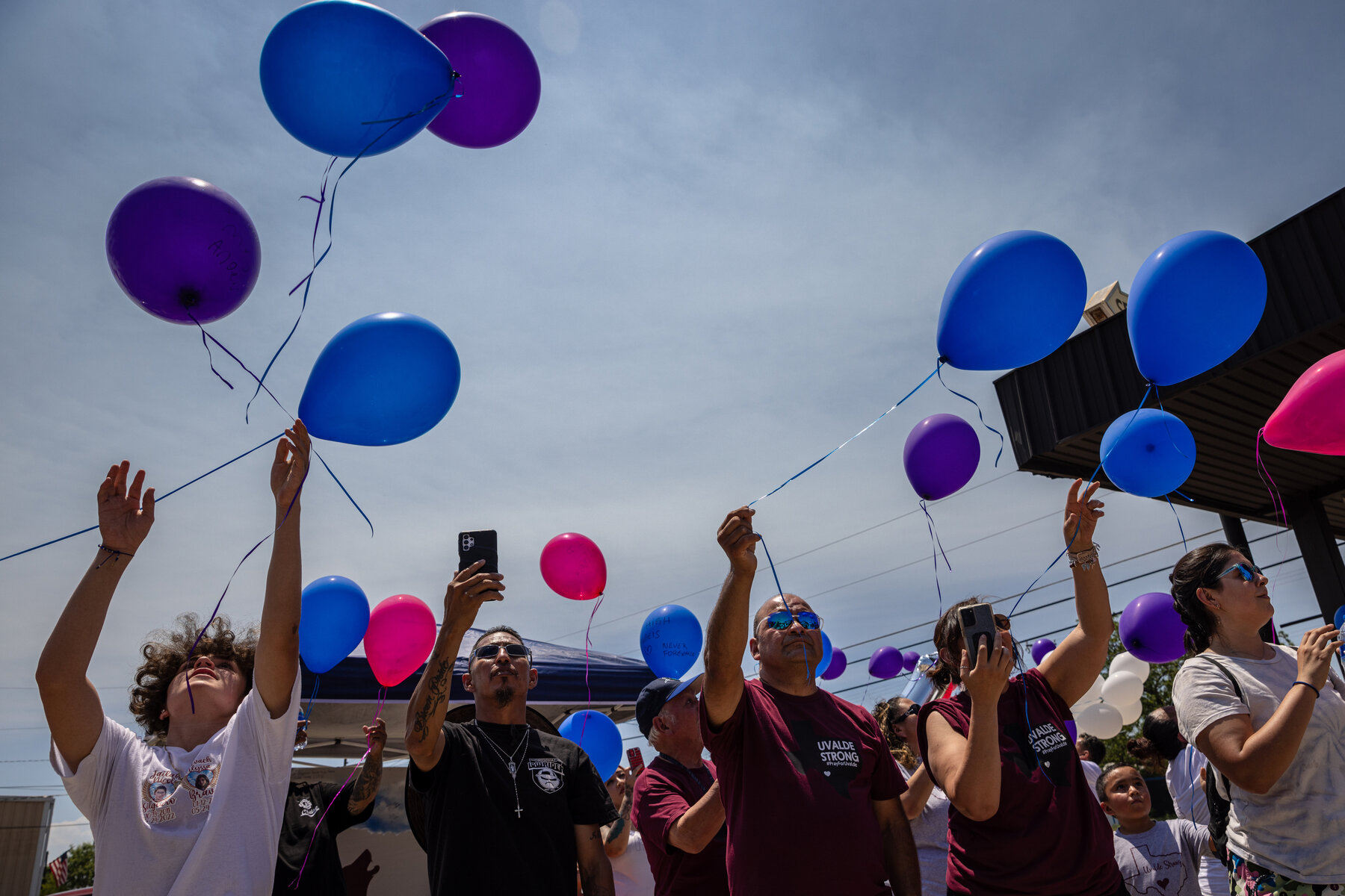 Uvalde residents and people from across Texas release balloons during an event honoring the victims.