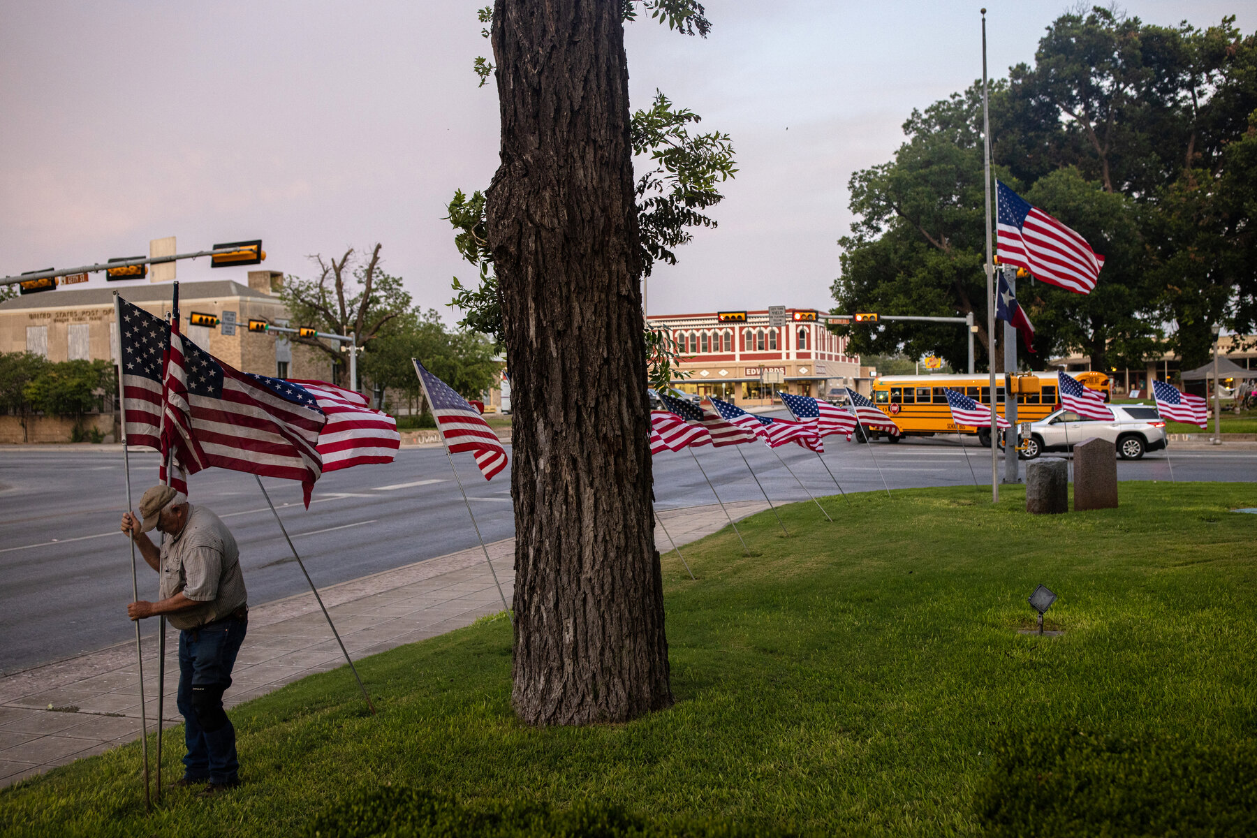 Vic Hilderbran, a member of the Uvalde Lions Club, placed flags around the Uvalde County Courthouse in observance of Flag Day.