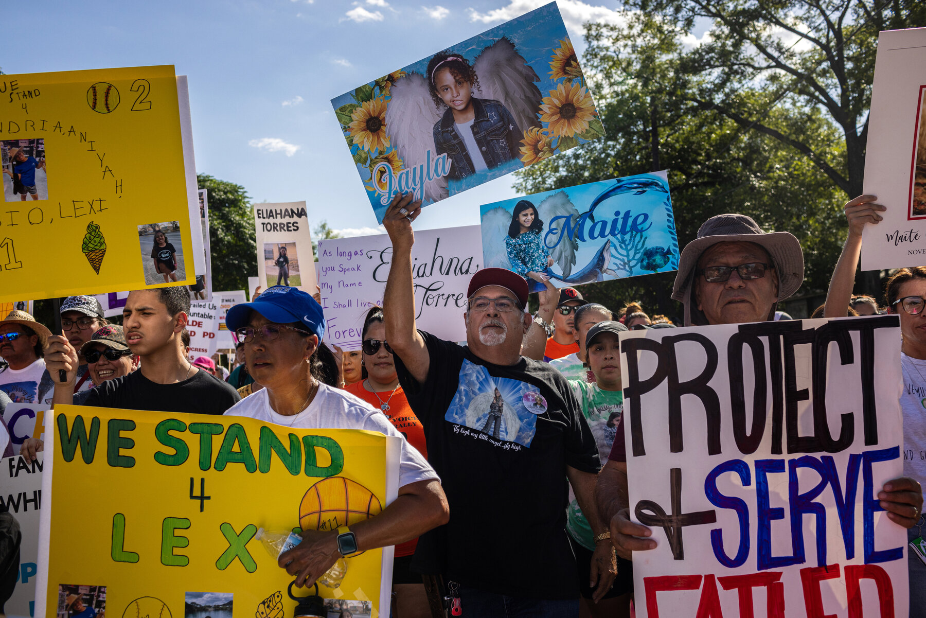 Vincent Salazar, center, the grandfather of Layla Salazar, 11, who was killed in the shooting, marched from the school to Uvalde’s town square.