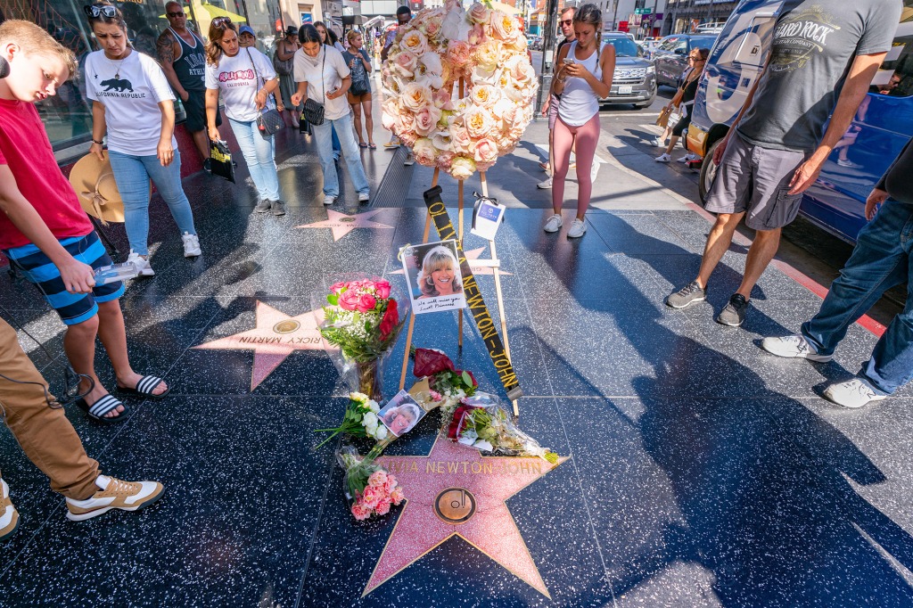 Flowers and photos decorate Newton-John's star on the Hollywood Walk of Fame in Los Angeles on Monday. 