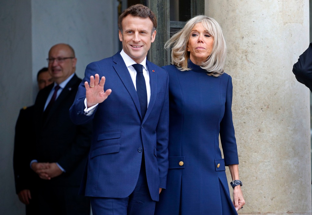 A report citing unnamed sources says that Trump claimed that have been privy to "intelligence" about Macron's private life. He is pictured with wife Brigitte.