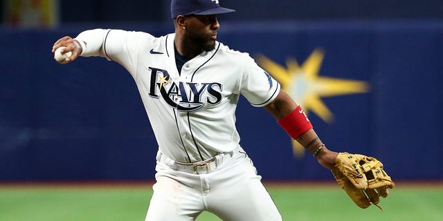 Yandy Diaz of the Tampa Bay Rays throws to first base after fielding a ground ball against the New York Yankees at Tropicana Field June 22, 2022, in St Petersburg, Fla.