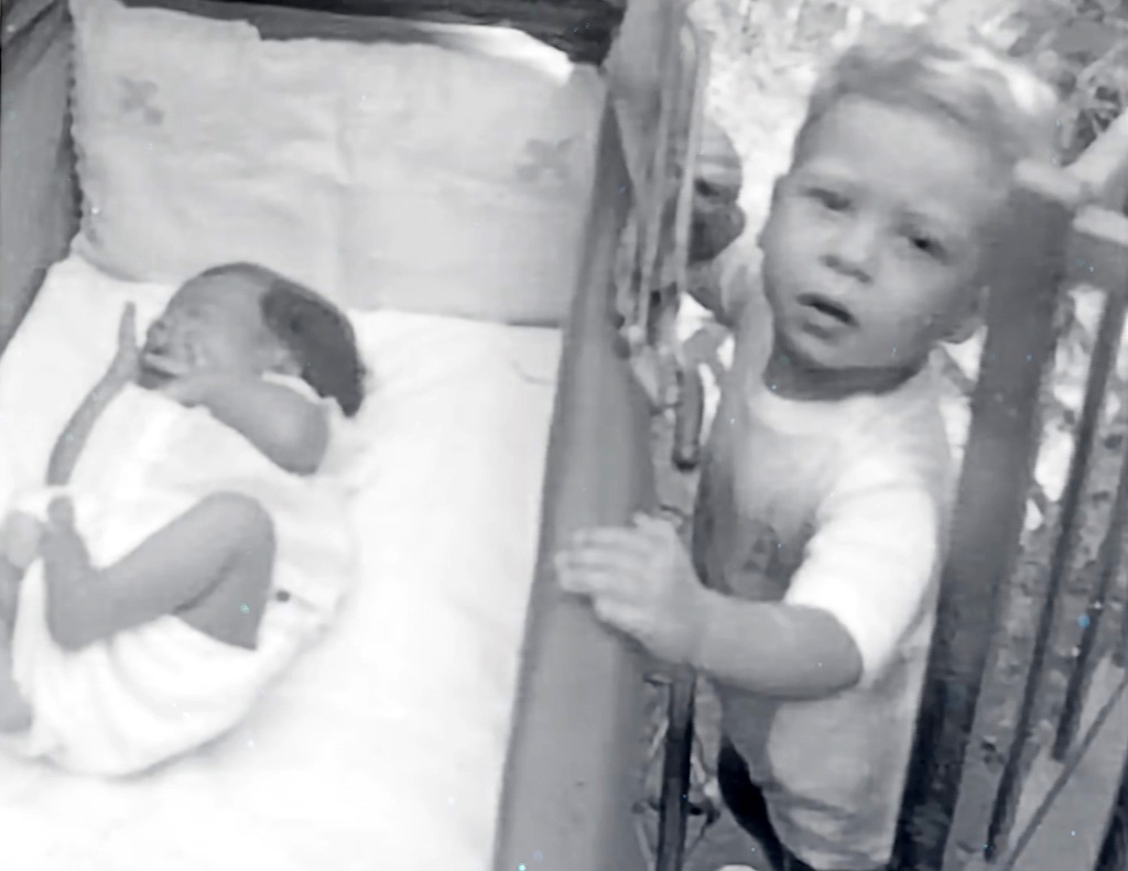Simmons (pictured in a cot alongside his older brother, Leonard) struggled with a childhood birth defect. He turned to food to cope and quickly piled on the pounds in the process.