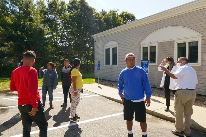 Migrants arrive in Martha's Vineyard after their left from the Joint Base Cape Cod. in Martha's Vineyard.