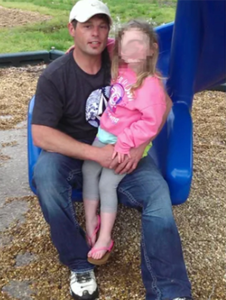 Edward Goodwin poses with his daughter.