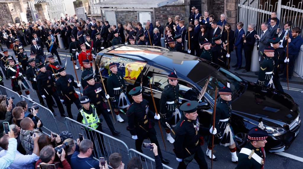 Queen Elizabeth's children walk behind their mother's casket as they process to St Giles Cathedral.