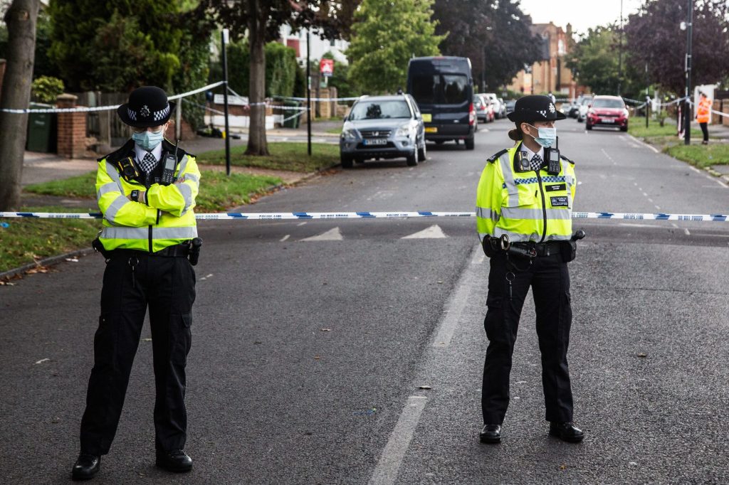 Police officers stand on guard at the crime scene in Kirkstall Gardens after Chris Kaba was shot dead.
