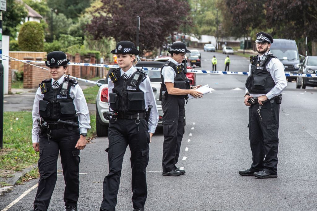 Police officers stand on guard at the crime scene in Kirkstall Gardens where Chris Kaba was shot dead by an armed Met Police unit following a car chase.