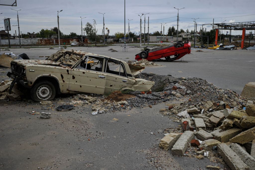 Destroyed cars, damaged as a result of Russian shelling are seen in Saltivka, a northern district of Kharkiv on Sept. 20, 2022.