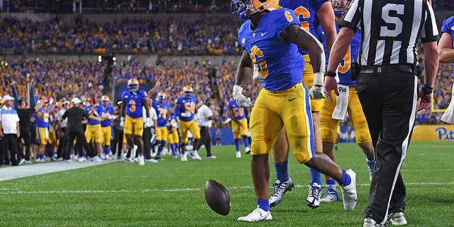 Rodney Hammond Jr. of the Pittsburgh Panthers celebrates after rushing for a touchdown in the second quarter during the game against the West Virginia Mountaineers at Acrisure Stadium in Pittsburgh on Thursday, Sept. 1, 2022.