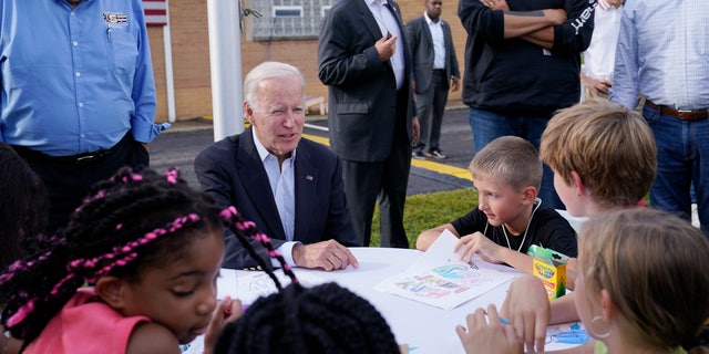 President Joe Biden talks to children outside a United Steelworkers of America Local Union 2227 event in West Mifflin, Pennsylvania, on Sept. 5, 2022.