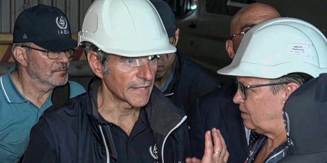 International Atomic Energy Agency (IAEA) director Rafael Grossi, the mission leader, center, and IAEA members inspect the Zaporizhzhia Nuclear Power Plant in Enerhodar, southeastern Ukraine Thursday Sept. 1, 2022. (Russian Defense Ministry Press Service via AP)