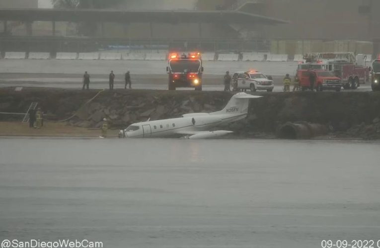 Navy plane crash lands on banks of San Diego Bay during Tropical Storm Kay weather