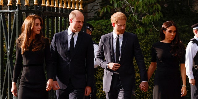 Britain's William, Prince of Wales, Catherine, Princess of Wales, Britain's Prince Harry and Meghan, the Duchess of Sussex, walk outside Windsor Castle, following the passing of Britain's Queen Elizabeth, in Windsor, Britain, Sept. 10, 2022.