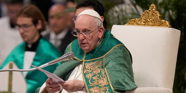 Pope Francis speaks to cardinals in St. Peter's Basilica at the Vatican during a mass Aug. 30, 2022.