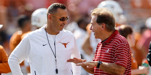 Head coach Steve Sarkisian of the Texas Longhorns, left, talks with head coach Nick Saban of the Alabama Crimson Tide before a game at Darrell K Royal-Texas Memorial Stadium Sept. 10, 2022, in Austin, Texas.