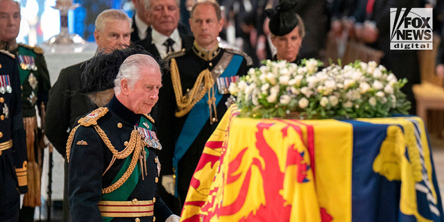 King Charles III overlooks the coffin of Queen Elizabeth II