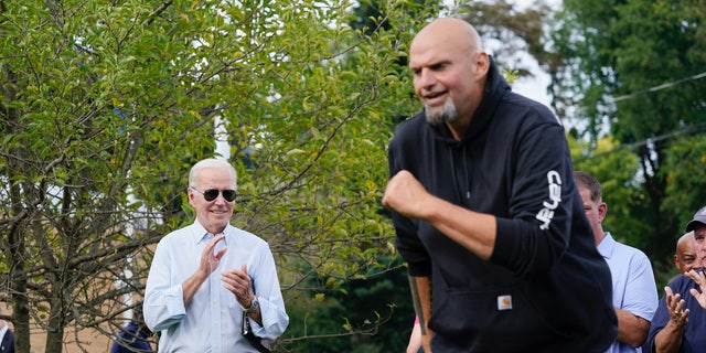 President Joe Biden watches as Democratic Pa. Lt. Gov. John Fetterman takes the stage at a United Steelworkers of America Local Union 2227 event in West Mifflin, Pa., Monday, Sept. 5, 2022, to honor workers on Labor Day. (AP Photo/Susan Walsh)