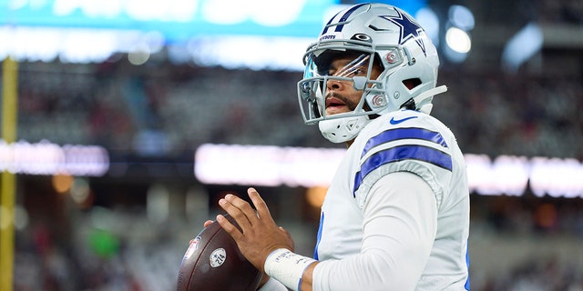 Dak Prescott, #4 of the Dallas Cowboys, warms up before kickoff against the Tampa Bay Buccaneers at AT&amp;T Stadium on Sept. 11, 2022 in Arlington, Texas. 