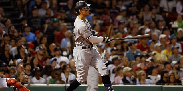 Aaron Judge #99 of the New York Yankees watches his solo home run against the Boston Red Sox during the third inning at Fenway Park on August 12, 2022 in Boston, Massachusetts.