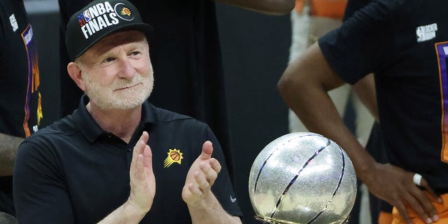 Owner Robert Sarver stands with the Western Conference championship trophy after the Suns beat the LA Clippers to win the series in Game 6 of the Western Conference finals at Staples Center June 30, 2021, in Los Angeles.