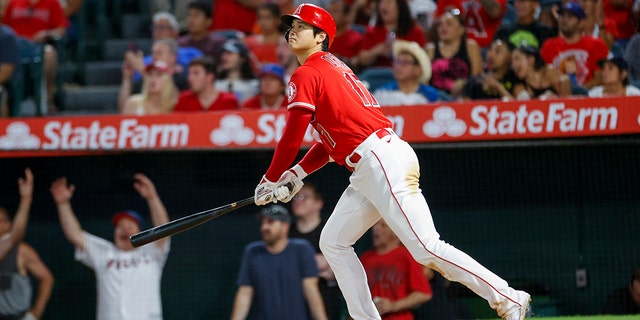 Los Angeles Angels' Shohei Ohtani watches his solo home run during the seventh inning of a baseball game against the Detroit Tigers in Anaheim, Calif., Monday, Sept. 5, 2022.