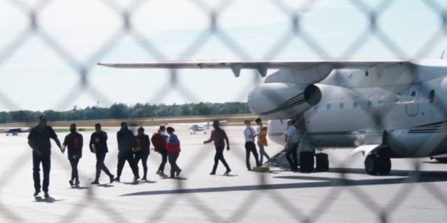 Illegal immigrants arrive at Martha's Vineyard Airport on Wednesday.