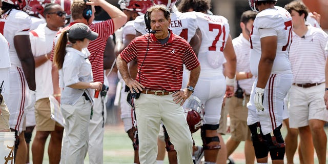 Head coach Nick Saban of the Alabama Crimson Tide talks on the headset during a timeout in the fourth quarter against the Texas Longhorns at Darrell K Royal-Texas Memorial Stadium on Sept. 10, 2022 in Austin, Texas. 