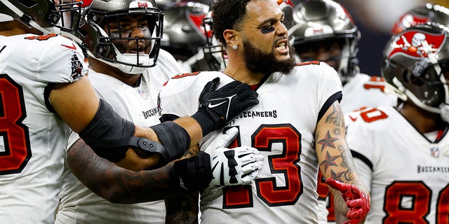 Marcus Maye #6 of the New Orleans Saints argues with Mike Evans #13 of the Tampa Bay Buccaneers on the field during the second half of the game at Caesars Superdome on September 18, 2022 in New Orleans, Louisiana.