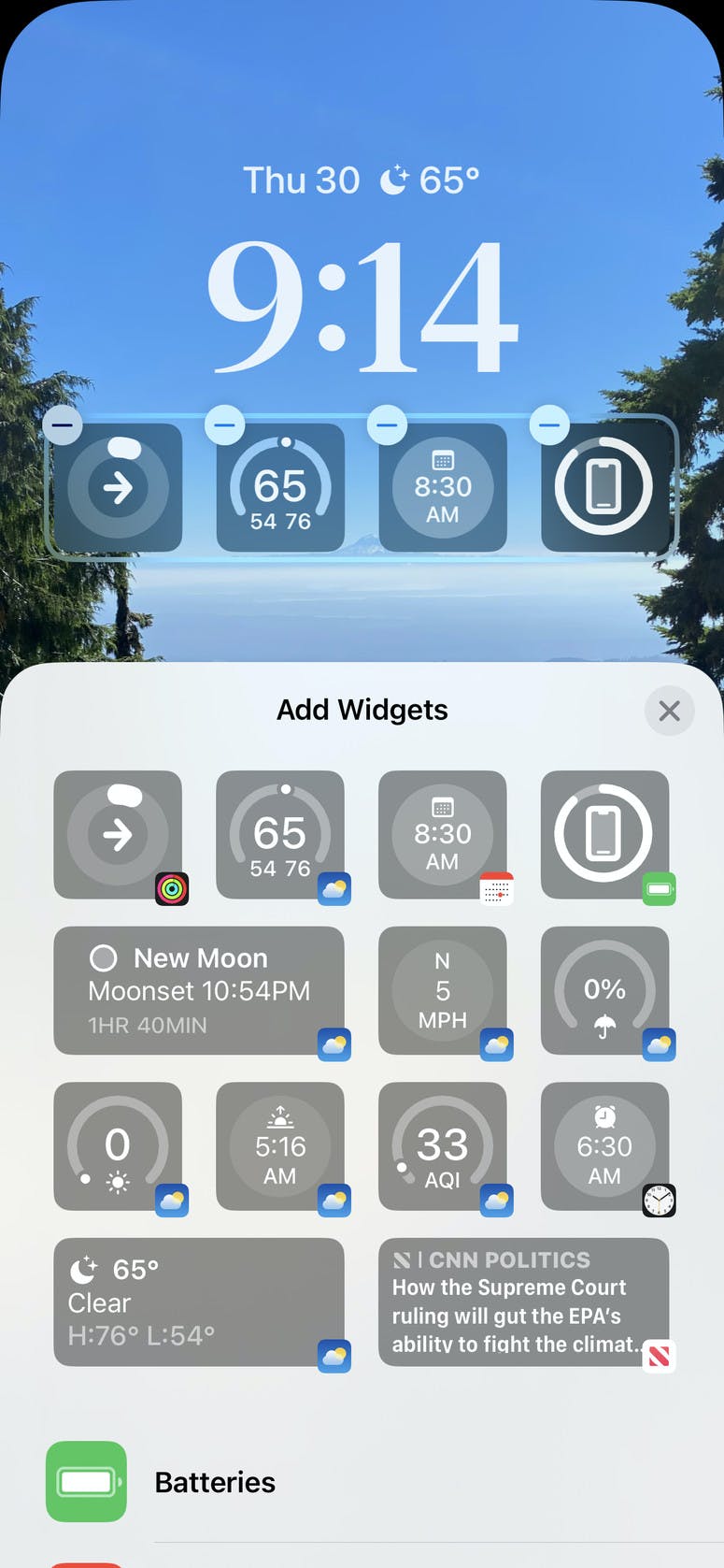 You can add up to four widgets in the shelf below the clock.