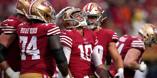 Jimmy Garoppolo (10) of the San Francisco 49ers reacts after scoring a touchdown against the Seattle Seahawks during the fourth quarter at Levi's Stadium Sept. 18, 2022, in Santa Clara, Calif.