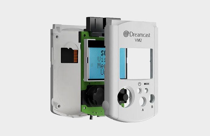 An exploded view of the VM2 memory card for the Sega Dreamcast, showing off the plastic shell, the printed circuit board, and the microSD card slot.