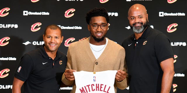 Cleveland Cavaliers president of basketball operations Koby Altman, left, Donovan Mitchell and head coach J.B. Bickerstaff pose for a photo during a press conference where Mitchell was introduced at Rocket Mortgage FieldHouse in Cleveland on Sept. 14, 2022.