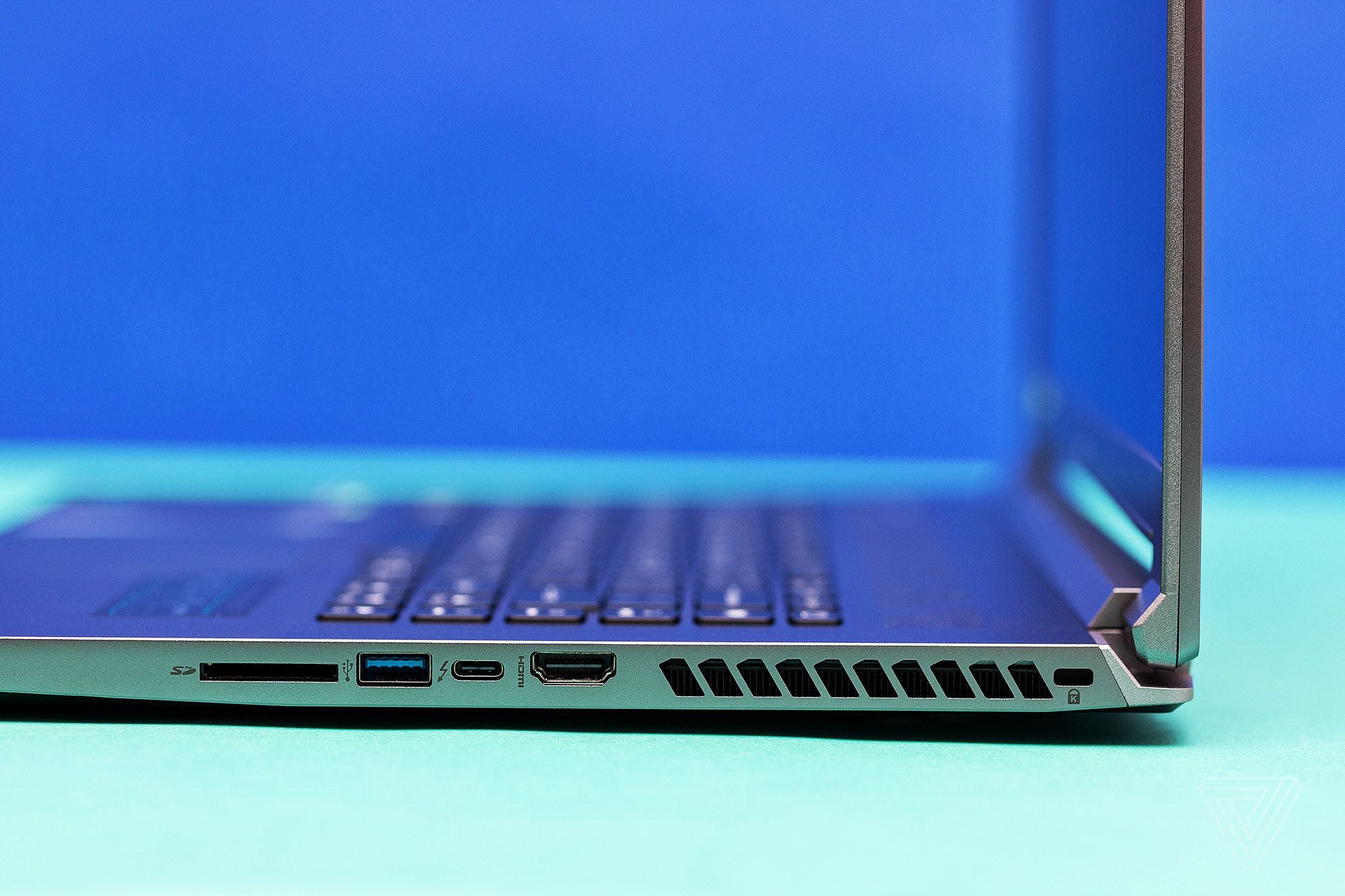 A left-side photo of the Acer Predator Triton 500 SE displaying a USB-A port, USB-C port, HDMI port and SD Card slot.