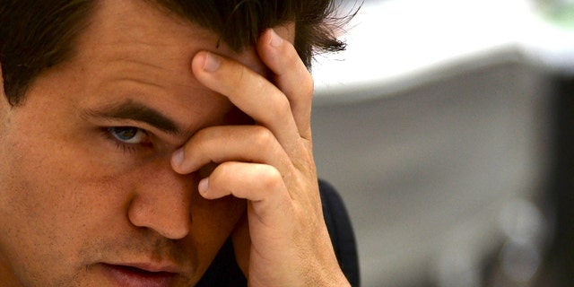 Norways Magnus Carlsen gestures during his Round 8 game against the Slovakia team at the 44th Chess Olympiad 2022, in Mahabalipuram on Aug. 6, 2022.